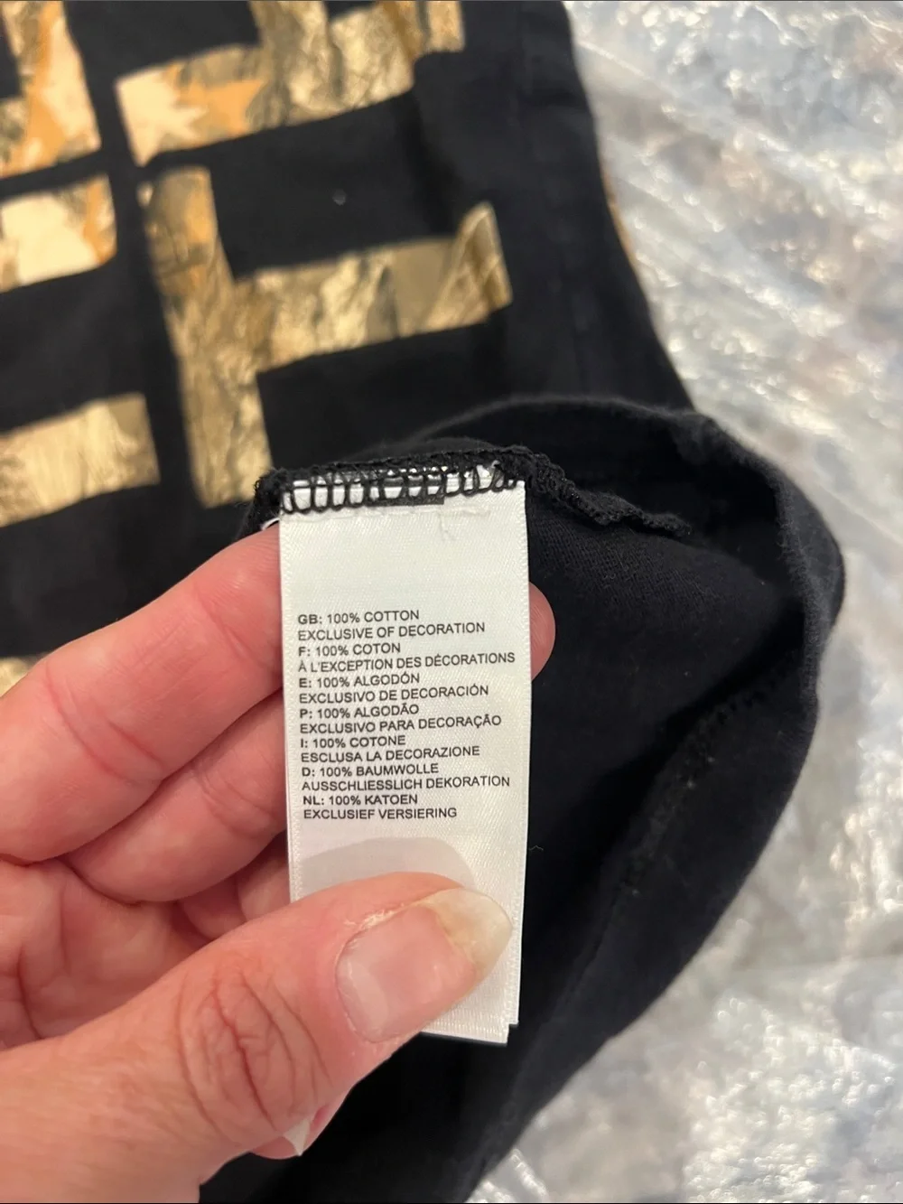 The North Face Black Tee with Gold Side Logo size XL.